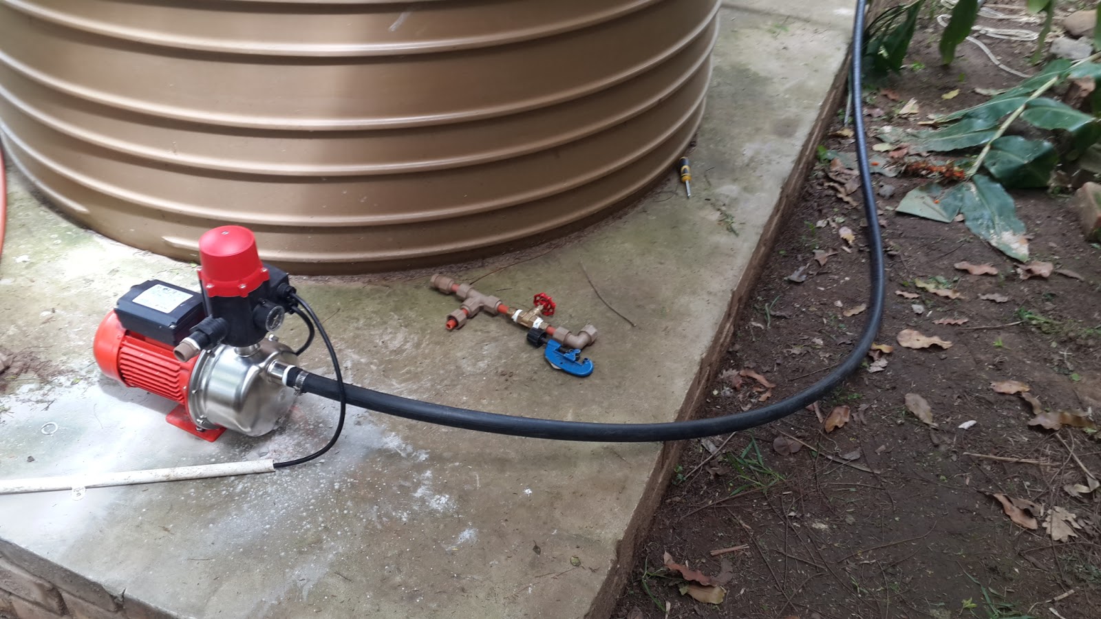 Water pump installation technician at work